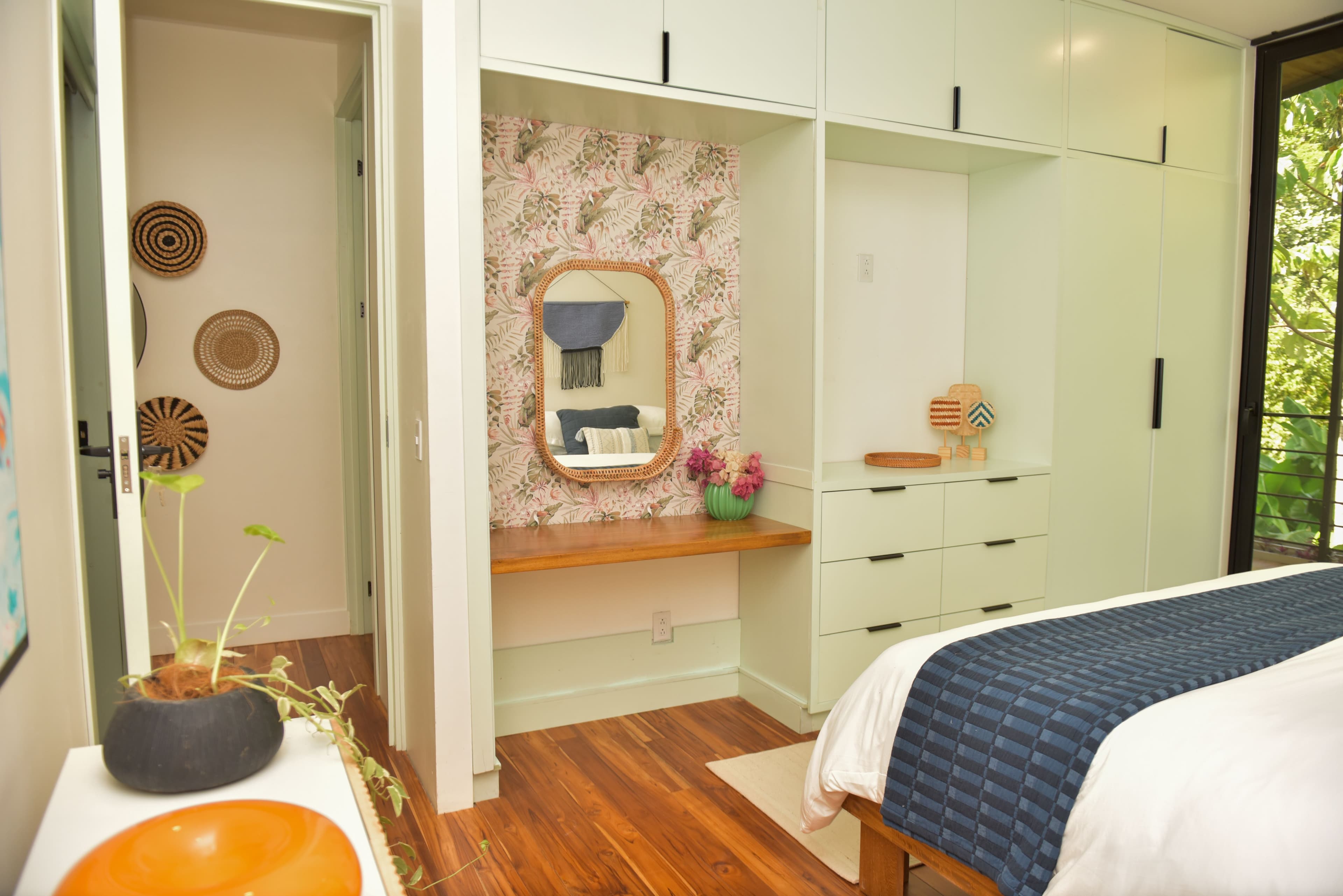 Main bedroom king suite with warm custom finishes