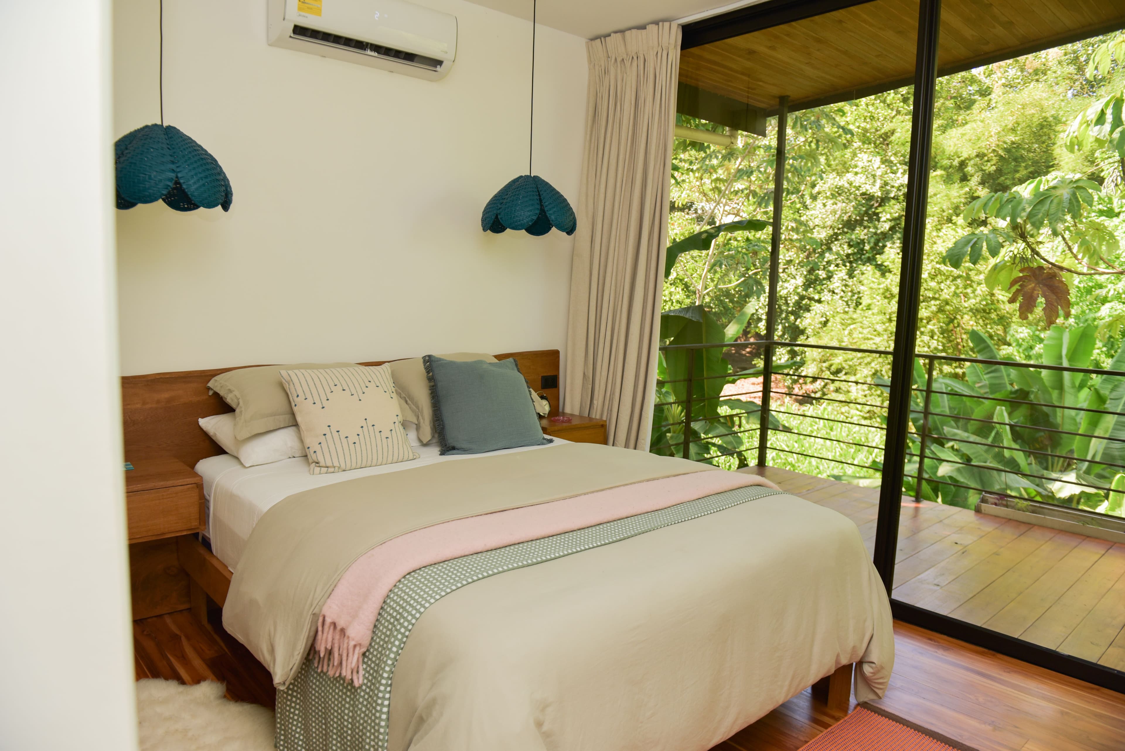 Riu House back bedroom with built-in storage and queen bed