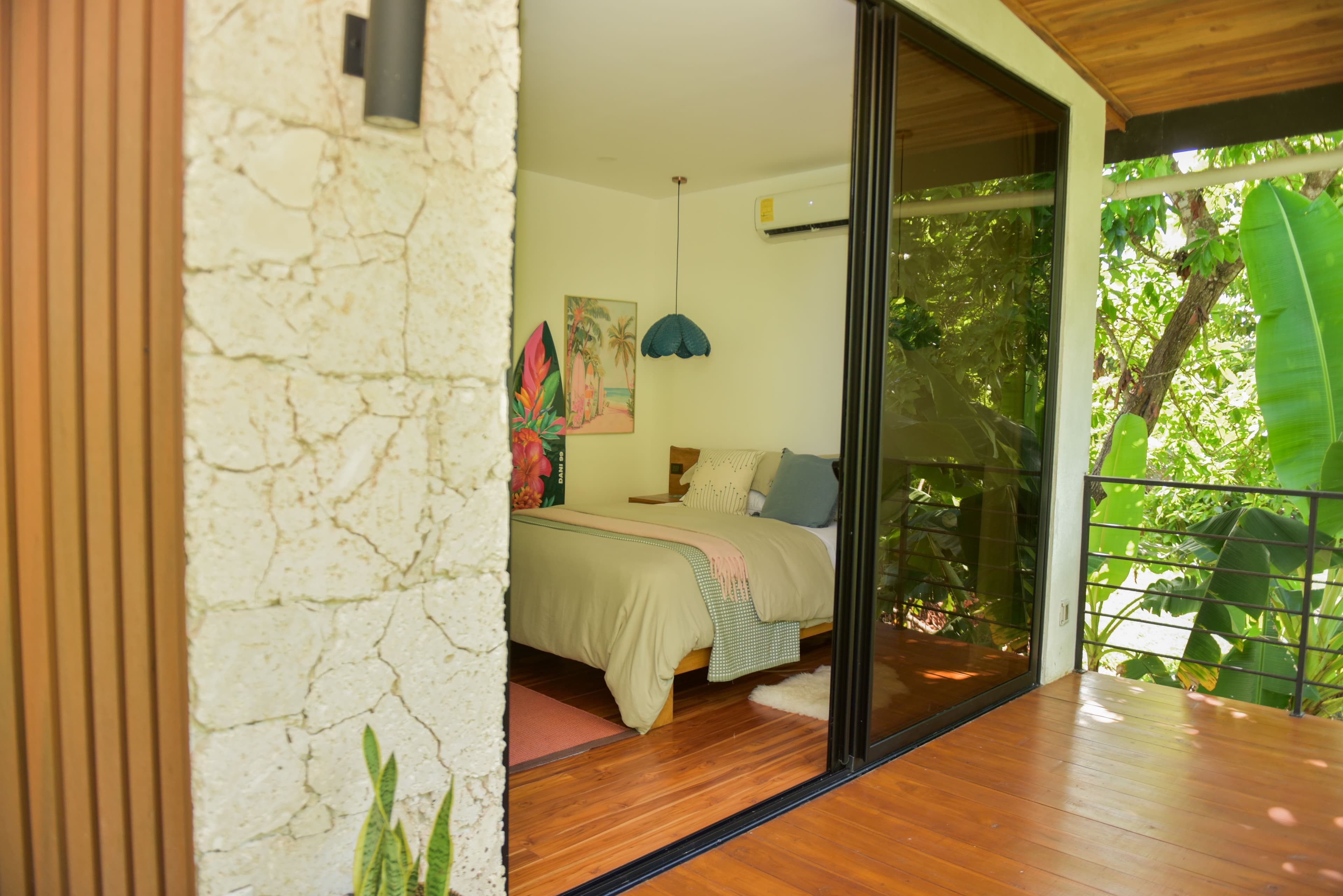 Riu House back bedroom with terrace access and warm finishes