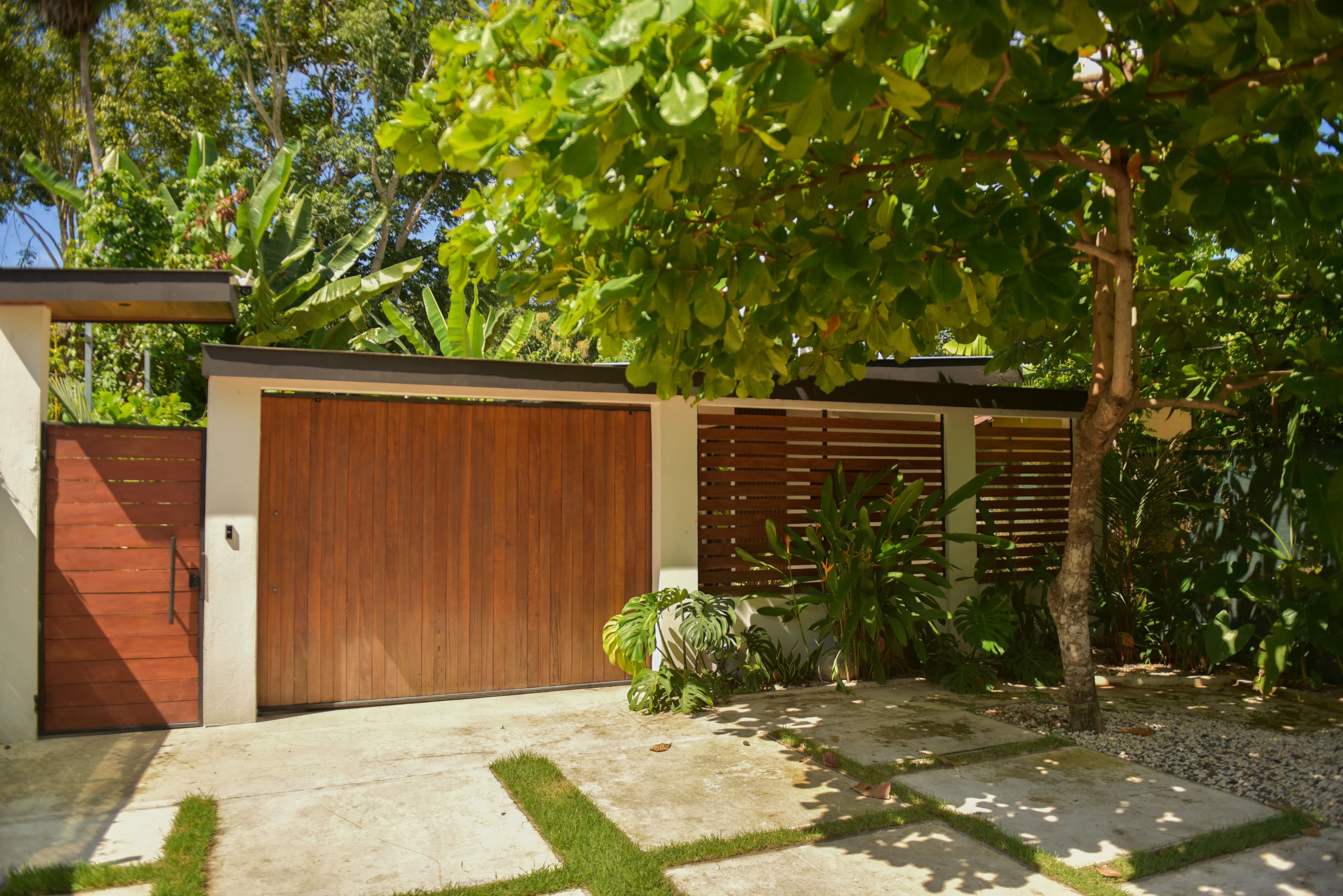 Front of Riu House showing glass doors and covered entry
