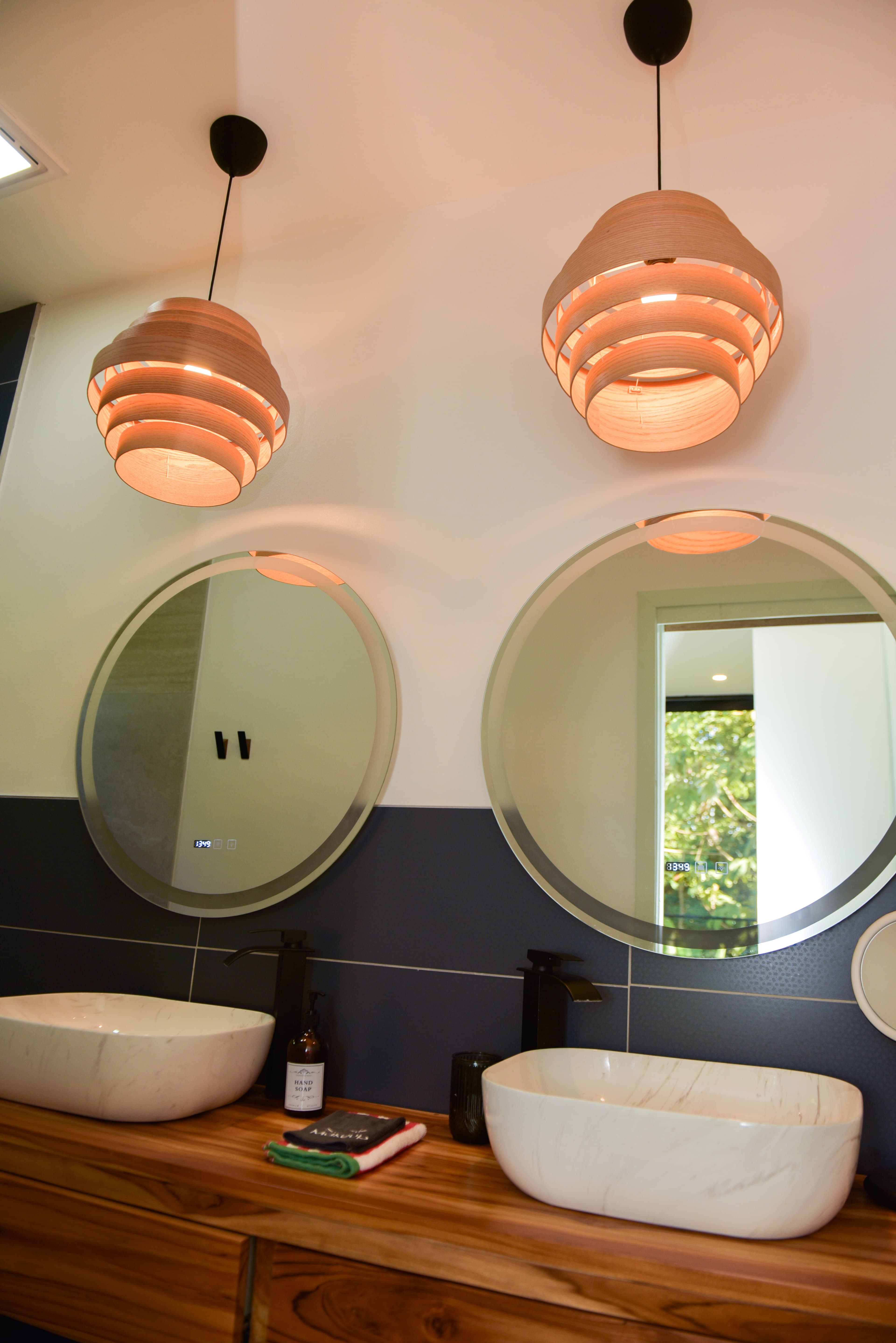 Main bedroom private bathroom double vanity and pendant lights