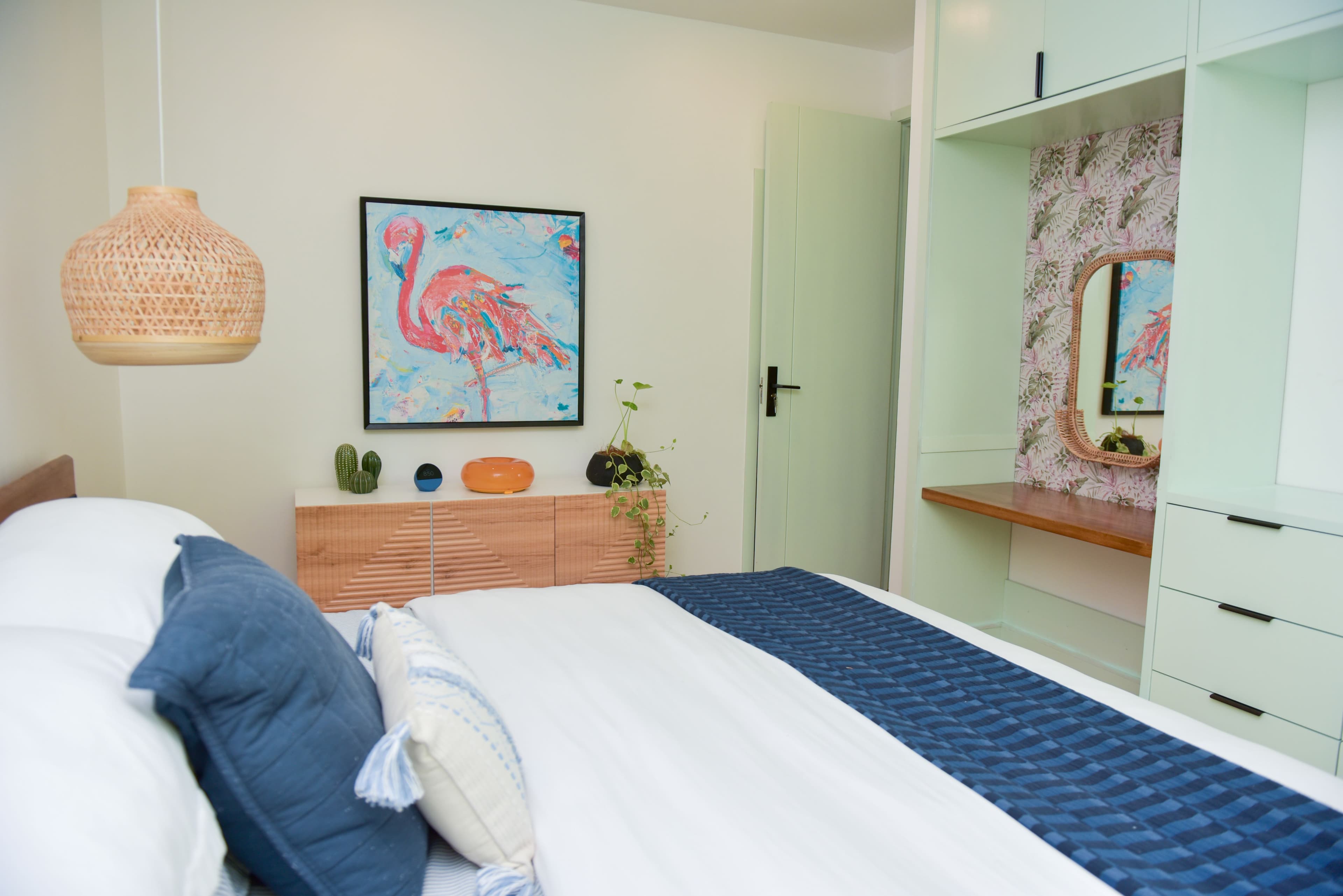 Main bedroom with built-in storage and television