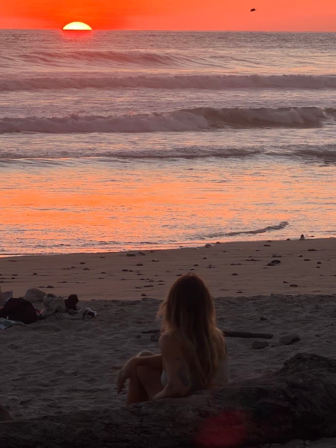 Guest enjoying a sunset on the beach in Costa Rica